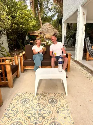 a man and a woman sitting on a couch at Orika del Mar Hotel in Isla Grande