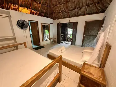 a bedroom with two beds in a room at Orika del Mar Hotel in Isla Grande