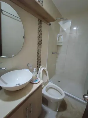 a bathroom with a sink and a toilet and a shower at Apartamento Cartagena cerca a la playa in Cartagena de Indias