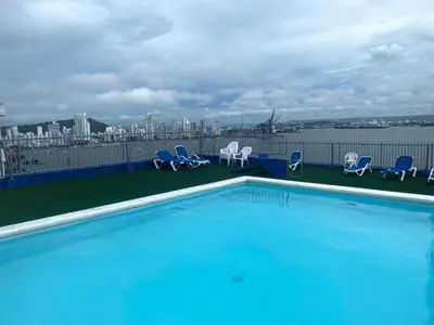 a swimming pool on the roof of a building at Portofino Bocagrande 2 habitaciones in Cartagena de Indias