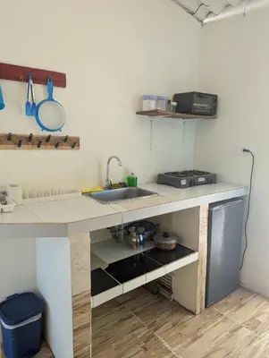 a kitchen with a sink and a counter at Casa Victoria in San Onofre