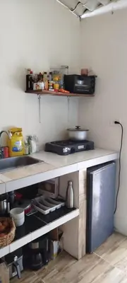 a kitchen with a sink and a counter top at Casa Victoria in San Onofre