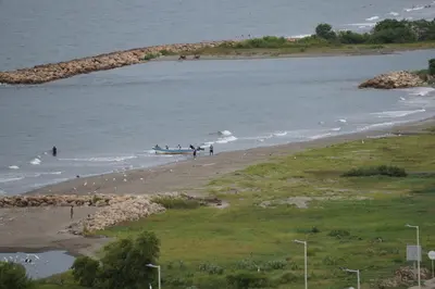 a group of people in a boat on the beach at Cartagena Aparta Suite Crespo Aeropuerto in Cartagena de Indias