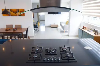 a kitchen with a stove top oven in a room at Confort en el norte de la ciudad in Ciudad Jardín