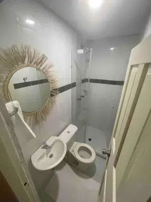 a small bathroom with a toilet and a mirror at Beautiful house en el centro in Cartagena de Indias