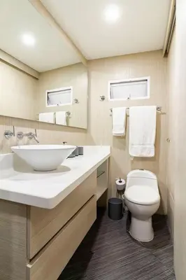 a bathroom with a white sink and a toilet at Playa Mar in Cartagena de Indias