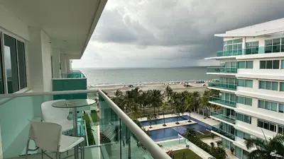a balcony with a view of the ocean and a beach at Apartamento con salida y vista a la playa in Cartagena de Indias