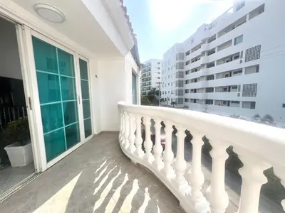 a balcony with a white railing and large windows at Private House - 4 Pisos - 100 Mts de la playa in Cartagena de Indias