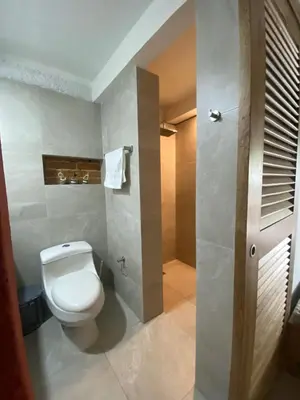 a bathroom with a toilet and a shower at Apartamento Loft in Cartagena de Indias