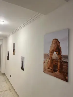 a group of pictures on a wall in a museum at Casa Piedra Barranquilla in Barranquilla