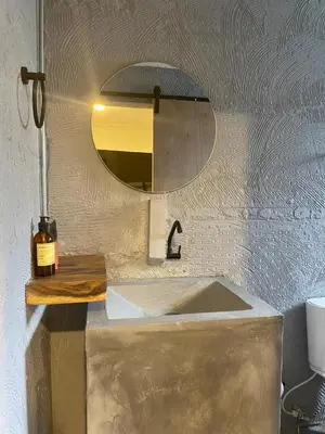 a bathroom with a sink and a mirror at Casa Piedra Barranquilla in Barranquilla