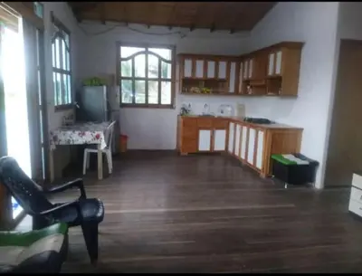 a large room with a kitchen and a table at Caribean campestre in Calao