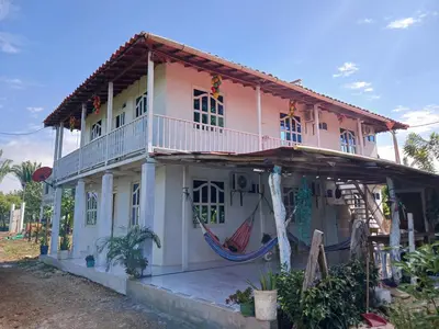 a house with a hammock in front of it at Caribean campestre in Calao