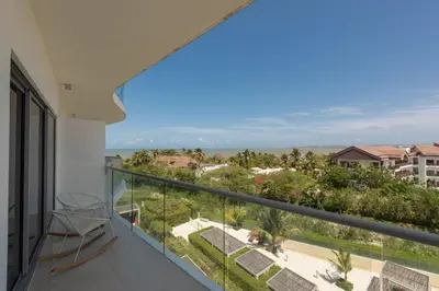a balcony with a view of the ocean at Frente al Mar, con playa y 4 piscinas en Cartagena in Cartagena de Indias