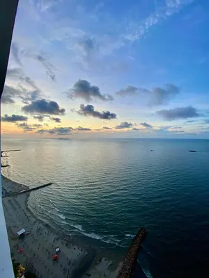 a view of the ocean with people on the beach at Palmetto elíptic apto 3302 vista al mar in Cartagena de Indias
