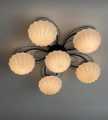a chandelier with four lights on a ceiling at Cartagena Espectacular apartamento en bocagrande in Cartagena de Indias