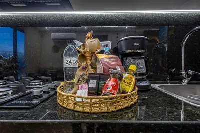 a basket of groceries sitting on a kitchen counter at Beachfront Condo 1605 Murano Centro 1, Near Walled City Airport Pick Up in Cartagena de Indias