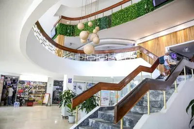 a spiral staircase in a store with plants at Moderno hospedaje privado con piscina in Cartagena de Indias