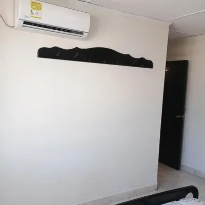 a shelf on the wall in a room at Hotel Villa Giron inn in Barranquilla