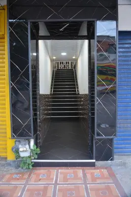 a stairway leading up to a building with stairs at Hotel Villa Giron inn in Barranquilla
