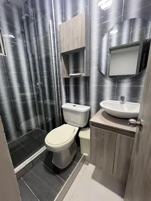 a bathroom with a toilet and a sink and a shower at Bello apartamento con visita al mar in Cartagena de Indias