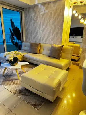 a living room with a couch and a table at Alojamiento Cartagena frente Al Mar in Cartagena de Indias