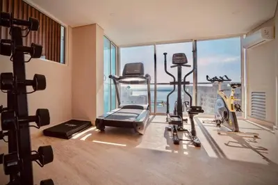 an apartment gym with a view of the ocean at Martinique Apto Private Jacuzzi - Netflix-Disney-Prime in Cartagena de Indias