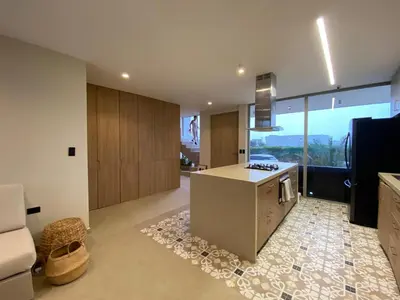 a kitchen with a counter and a stove top oven at Casa frente a la playa in Salina de Rey