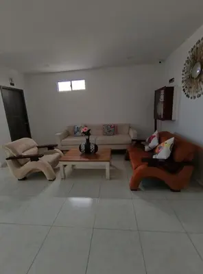 a living room with couches and a table at Postel bar hotel in Cartagena de Indias