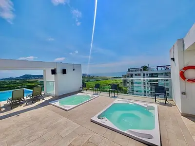a patio with a swimming pool on top of a building at Dominique 1101 - Espectacular Apto con Jacuzzi in Cartagena de Indias