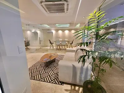 a living room with a couch and a table and chairs at Dominique 1101 - Espectacular Apto con Jacuzzi in Cartagena de Indias