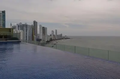 a view of the ocean and a city with buildings at New Apartment With 1 Bedroom In H2 in Cartagena de Indias