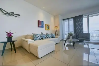a living room with a couch and a table at New Apartment With 1 Bedroom In H2 in Cartagena de Indias