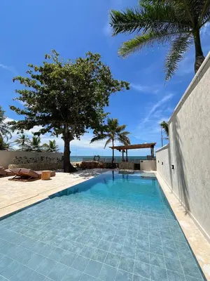 a swimming pool with a view of the beach at Talam House Coveñas by Bernalo Hotels in Coveñas