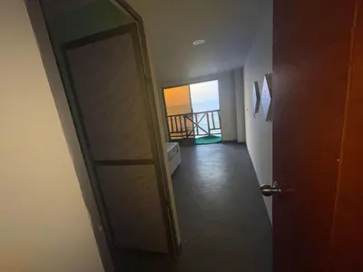 a door leading to a room with a balcony at Hotel Miramar Baru in Playa Blanca