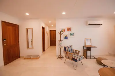 a living room with two chairs and a table at Caribbean Beachfront Getaway in Cartagena de Indias