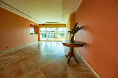 a hallway with a table with a vase on it at Caribbean Beachfront Getaway in Cartagena de Indias
