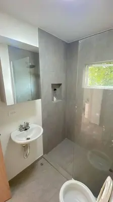 a bathroom with a toilet and a sink at Casa Mar in Puerto Colombia