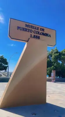 a sign for a monument in a parking lot at Casa Mar in Puerto Colombia