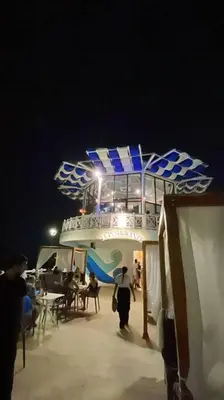 a group of people on a cruise ship at night at Casa Mar in Puerto Colombia