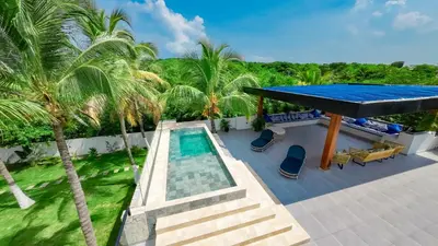 an aerial view of a house with a swimming pool at Villa de lujo frente al mar en Tierra Bomba in Cartagena de Indias