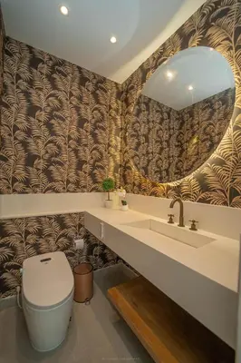 a bathroom with a toilet and a sink and a mirror at Villa de lujo frente al mar en Tierra Bomba in Cartagena de Indias