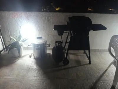 a light shines on a table and a camera in a room at Hostel AC in Cartagena de Indias