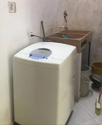 a washing machine in a room with a sink at apartamento san antero in San Antero