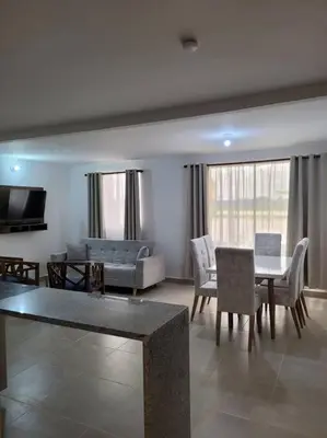 a living room with a couch and a table and chairs at Refugio de ensueño in Manzanillo del Mar