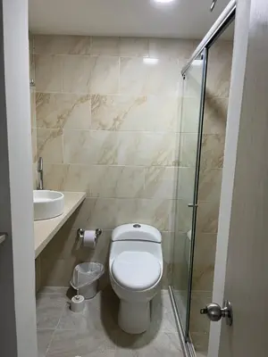 a bathroom with a toilet and a sink and a shower at Apartamento Económico En Coveñas in Coveñas