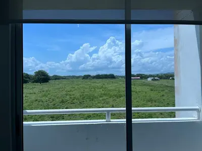 a view of a field from a window at Apartamento Económico En Coveñas in Coveñas