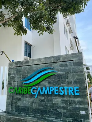 a sign in front of a building at Apartamento Económico En Coveñas in Coveñas