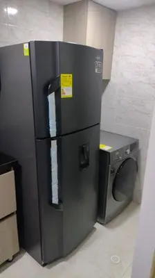 a refrigerator and a washing machine in a room at CARTAGENA CONFORT APARTAMENTO NUEVO y COMPLETO in Cartagena de Indias