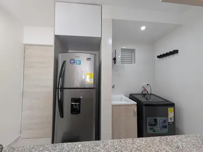 a kitchen with a stainless steel refrigerator and a sink at Apartamento con 3 habitaciones y Vista al Mar in Cartagena de Indias